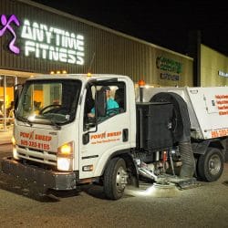 Power Sweeping in Retail Parking Lot with Truck