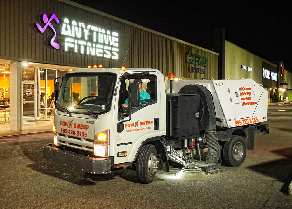 Power Sweeping in Retail Parking Lot with Truck