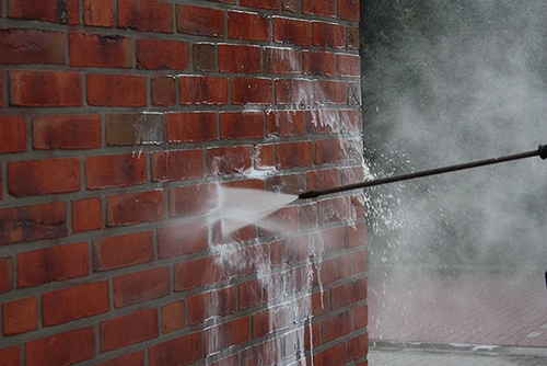 Power Washing Brick Wall